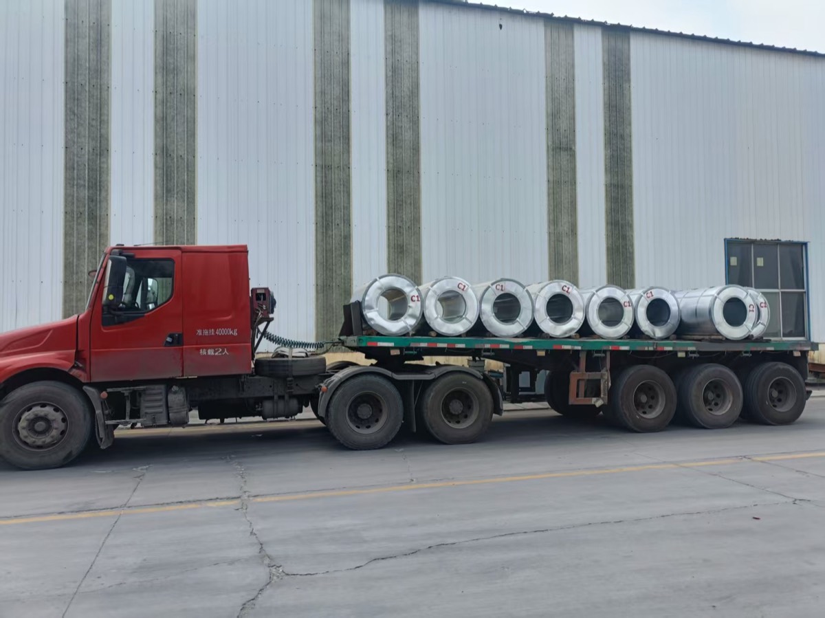 Truck carrying coils from the mill to the port